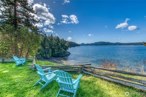 a view of a swimming pool with an outdoor seating and a garden