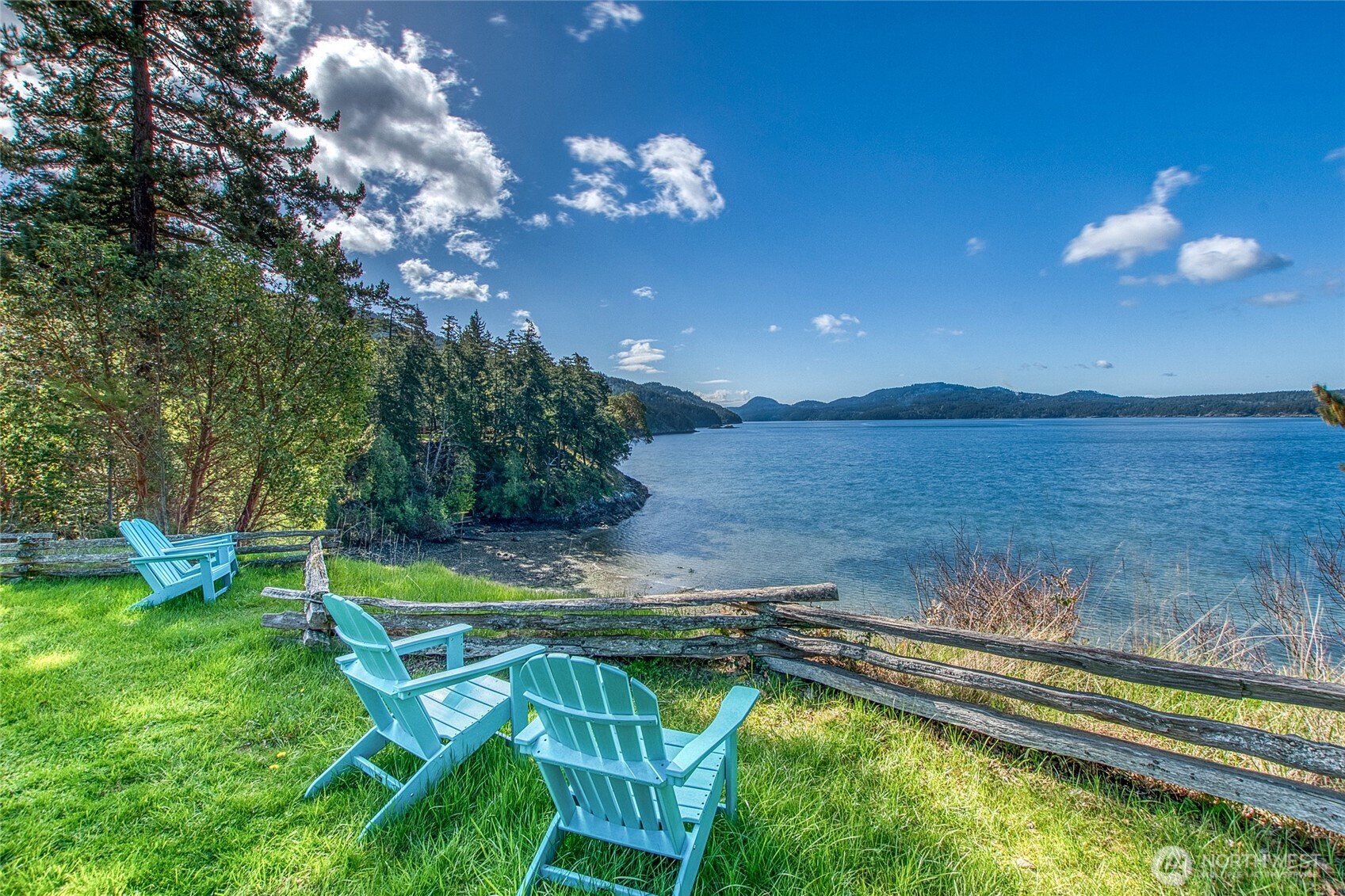326 Olga Road Orcas Island, WA 98245 - Photo 4 of 39 a view of a swimming pool with an outdoor seating and a garden