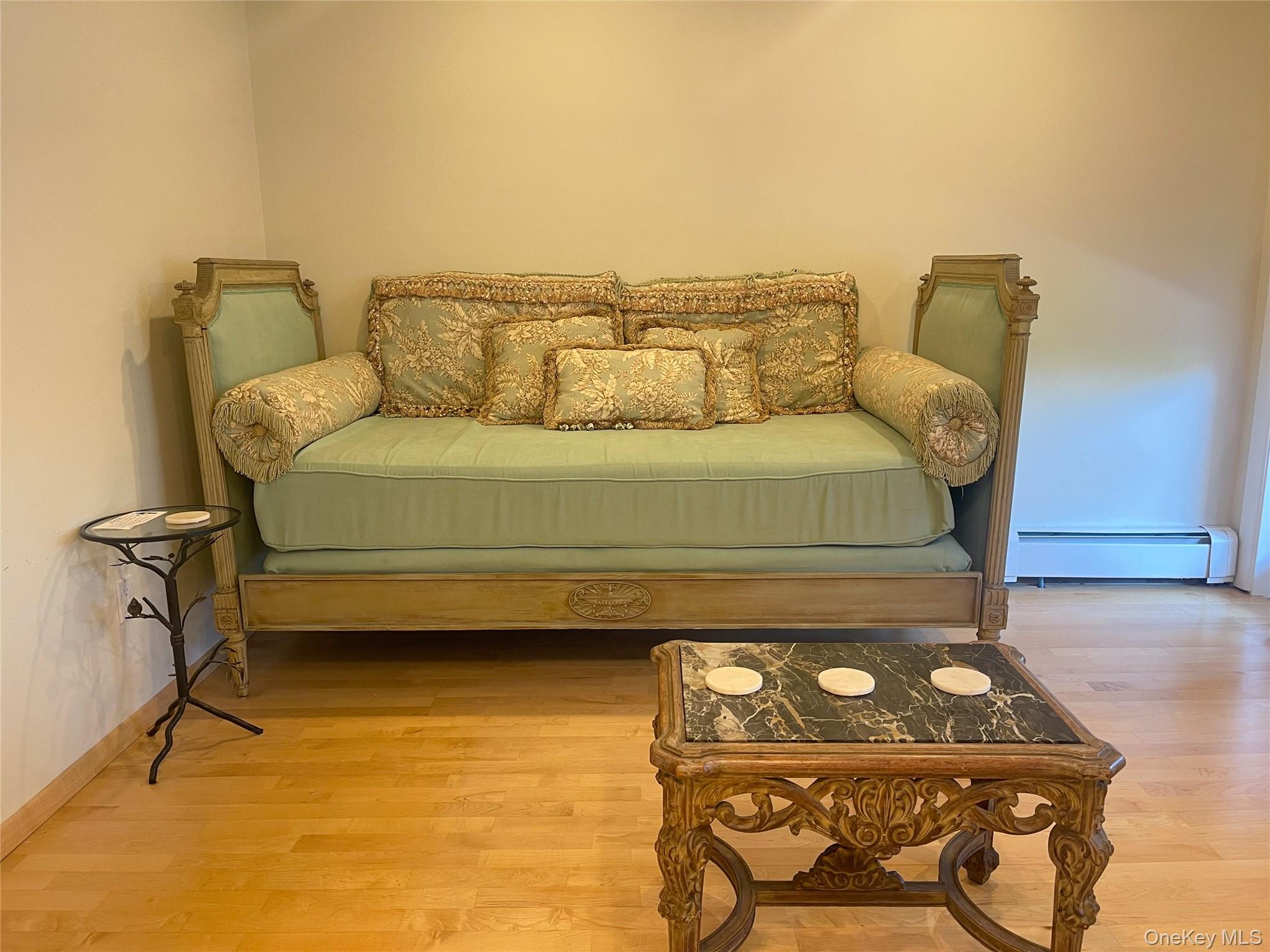 379 Bluff Road, Unit 115 Amagansett, NY 11930 - Photo 13 of 28 a bed sitting in a bedroom next to a window