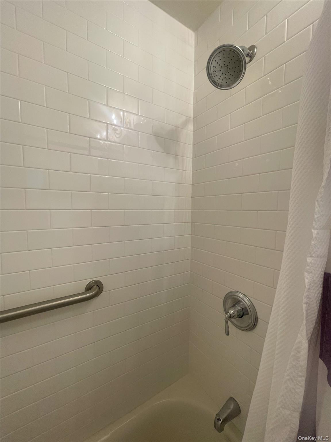 379 Bluff Road, Unit 115 Amagansett, NY 11930 - Photo 19 of 28 a bathroom with a shower