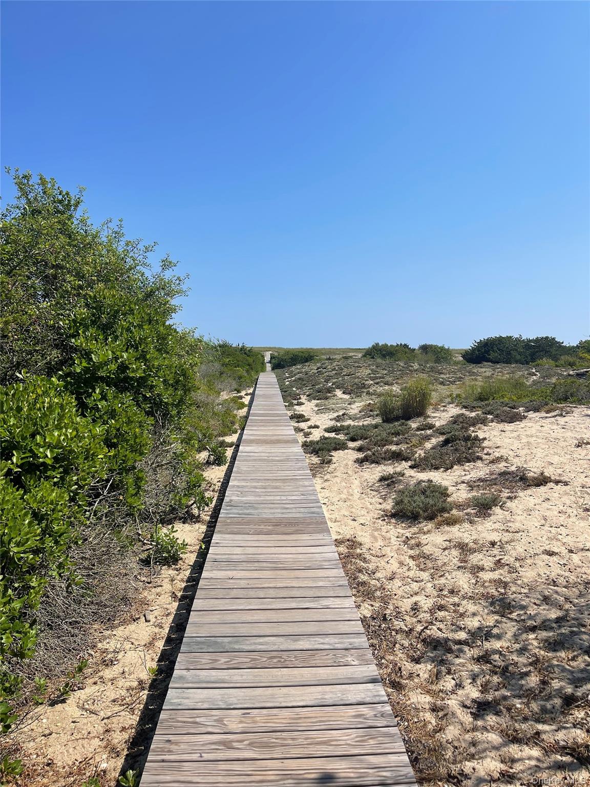 379 Bluff Road, Unit 115 Amagansett, NY 11930 - Photo 24 of 28 a view of outdoor space with ocean view