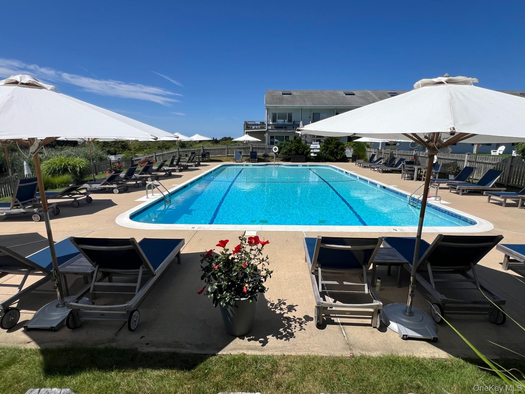 379 Bluff Road, Unit 115 Amagansett, NY 11930 - Photo 27 of 28 a view of a backyard with sitting area