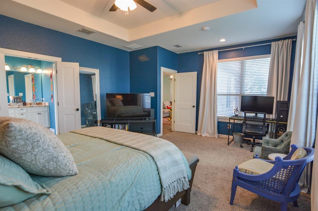 601 Mathew Street Grandview, TX 76050 - Photo 22 of 40 a bedroom with a bed and a flat screen tv