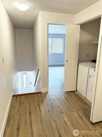 a view of front door with wooden floor
