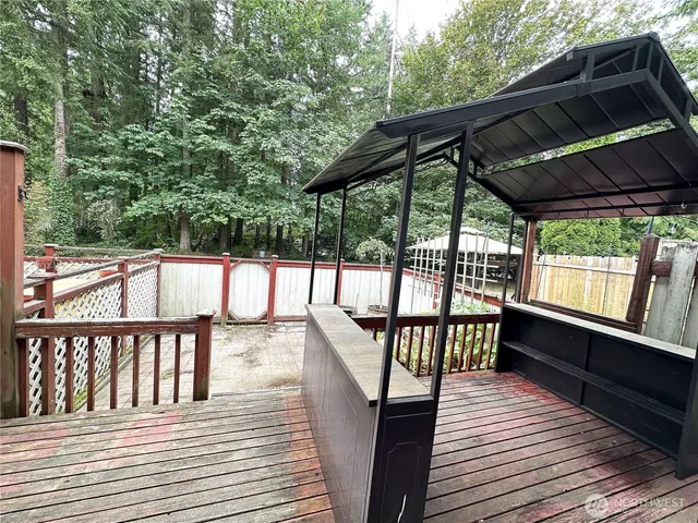 a view of deck with wooden floor and outdoor seating