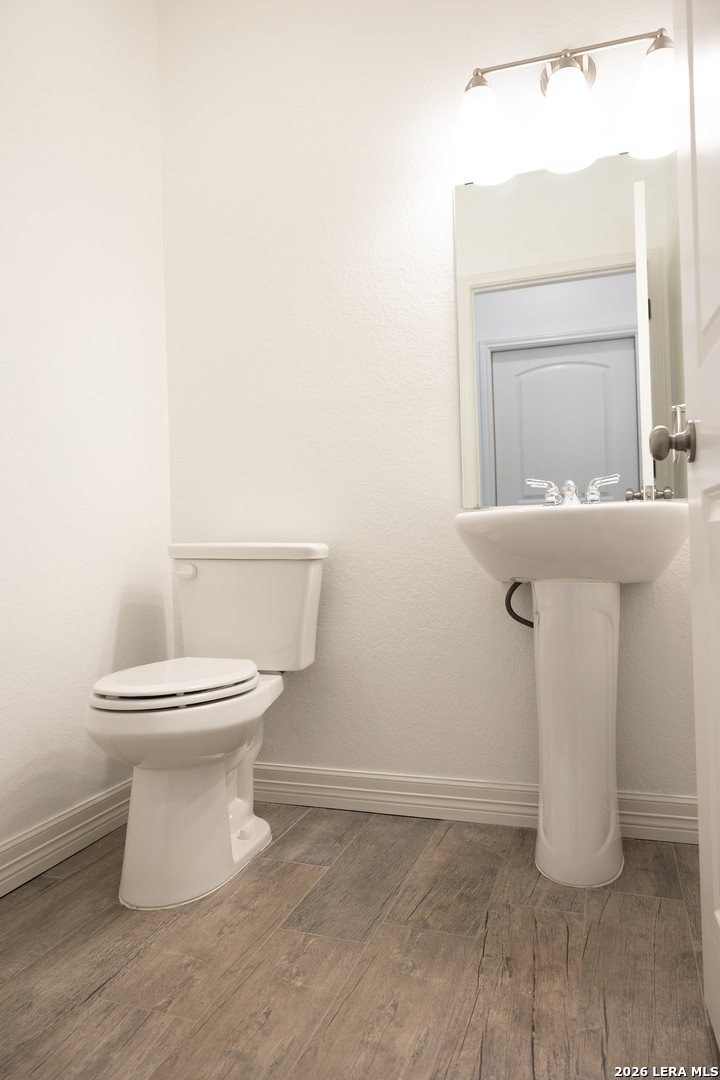 20 Rio Seco Uvalde, TX 78801 - Photo 11 of 21 a white toilet sitting next to a bathroom sink