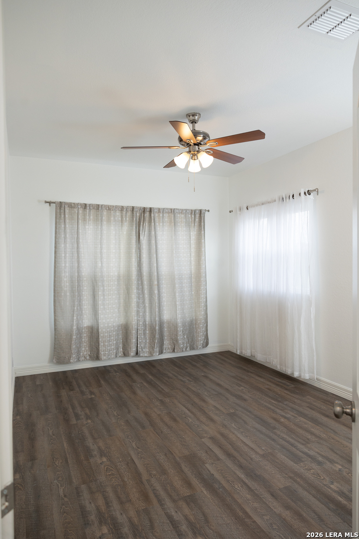 20 Rio Seco Uvalde, TX 78801 - Photo 17 of 21 an empty room with wooden floor and fan