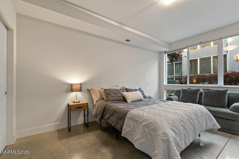 374 State Street Reno, NV 89501 - Photo 12 of 16 a bedroom with double bed and a large window