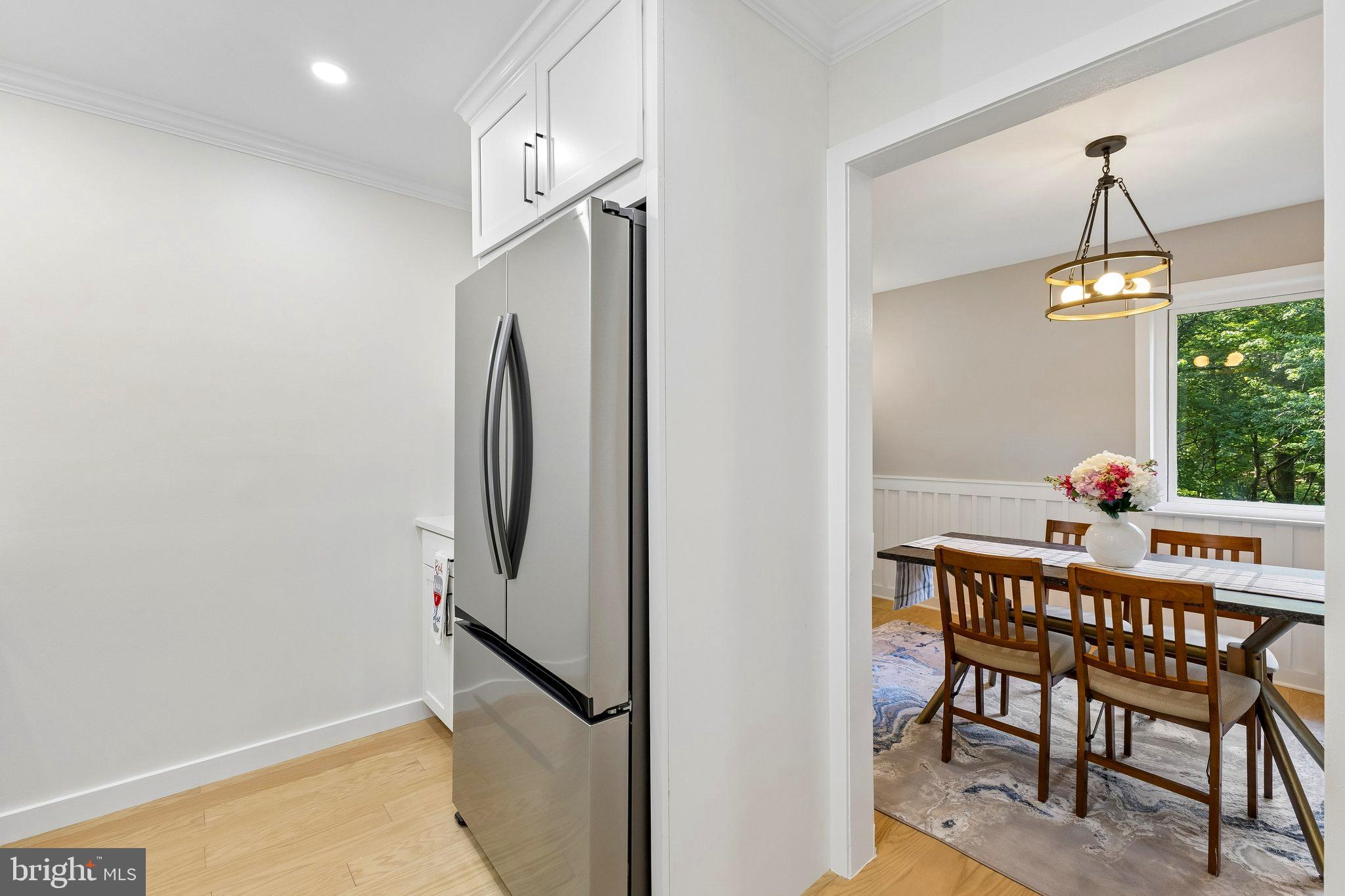 11841 Shire Court, Unit 31D Reston, VA 20191 - Photo 16 of 24 a dining room with furniture and window