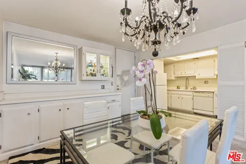 a very nice looking dining room with a table and chairs