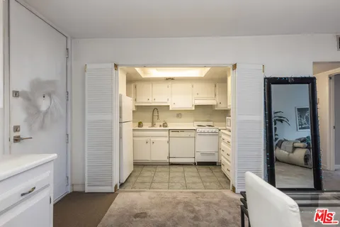 a bathroom with a shower and a sink