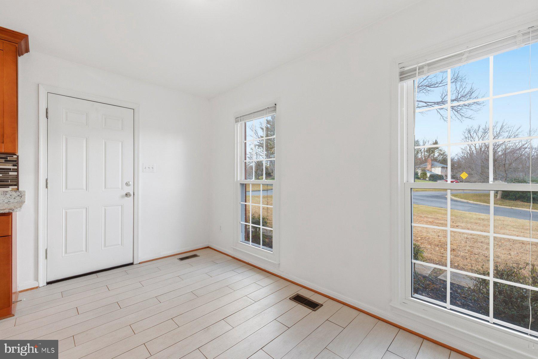 11733 Becket Street Potomac, MD 20854 - Photo 11 of 27 an empty room with windows
