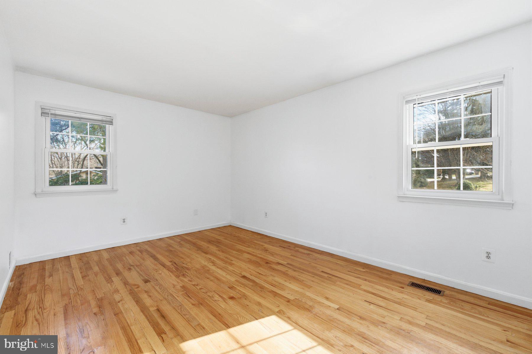 11733 Becket Street Potomac, MD 20854 - Photo 12 of 27 a view of empty room with wooden floor and fan