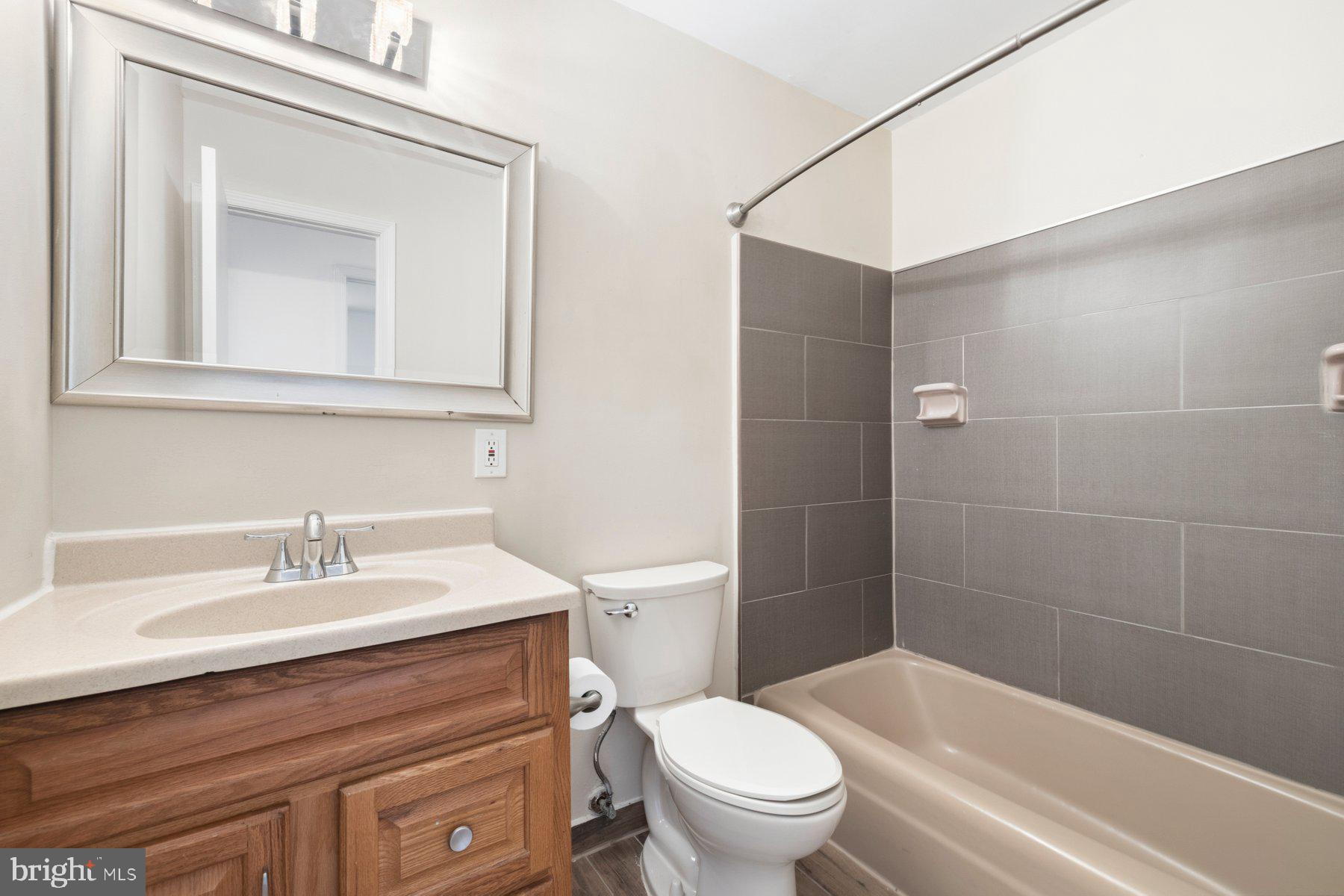 11733 Becket Street Potomac, MD 20854 - Photo 18 of 27 a bathroom with a sink a toilet and shower