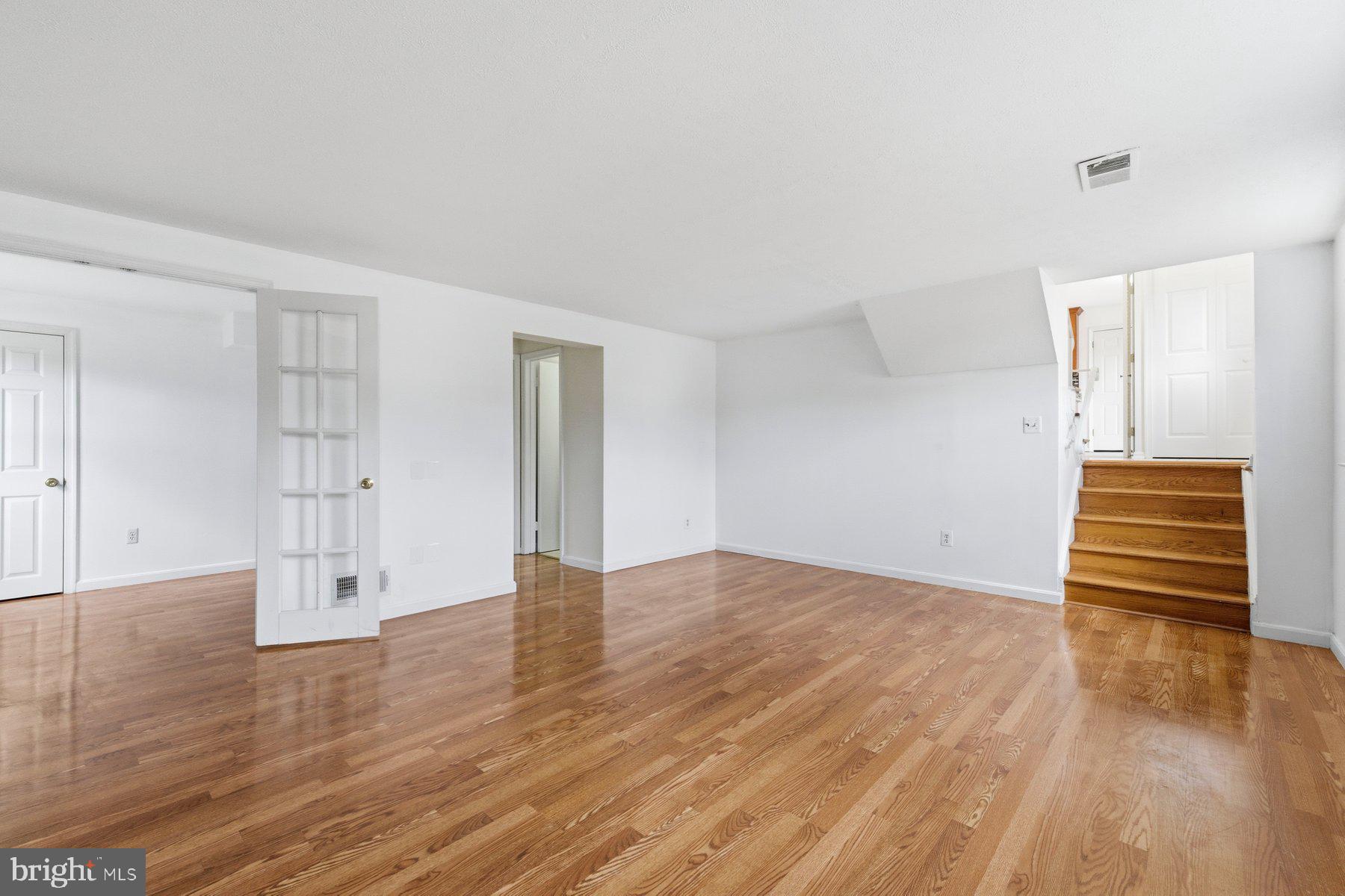 11733 Becket Street Potomac, MD 20854 - Photo 20 of 27 a view of empty room with wooden floor