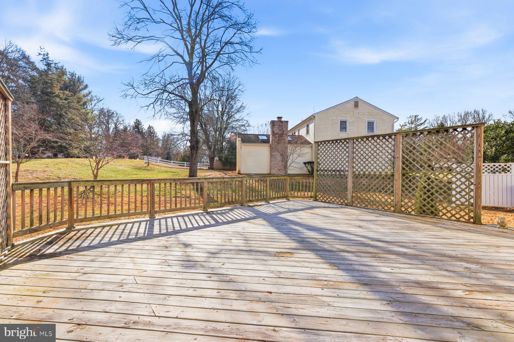 11733 Becket Street Potomac, MD 20854 - Photo 26 of 27 a view of a terrace with wooden floor and fence
