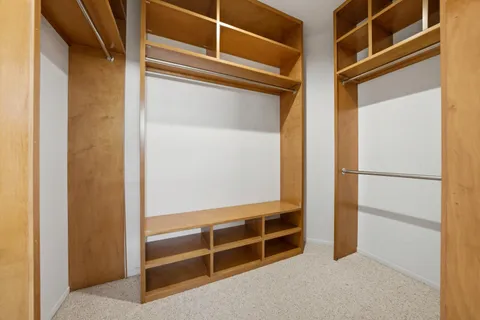 a view of an empty walk in closet