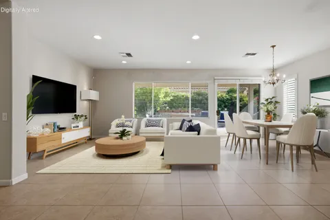a living room with furniture and flat screen tv