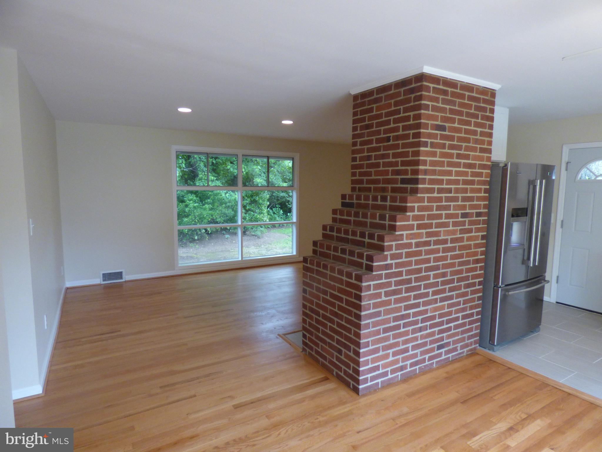 6603 Edsall Road Springfield, VA 22151 - Photo 8 of 30 a view of empty room with wooden floor and fan