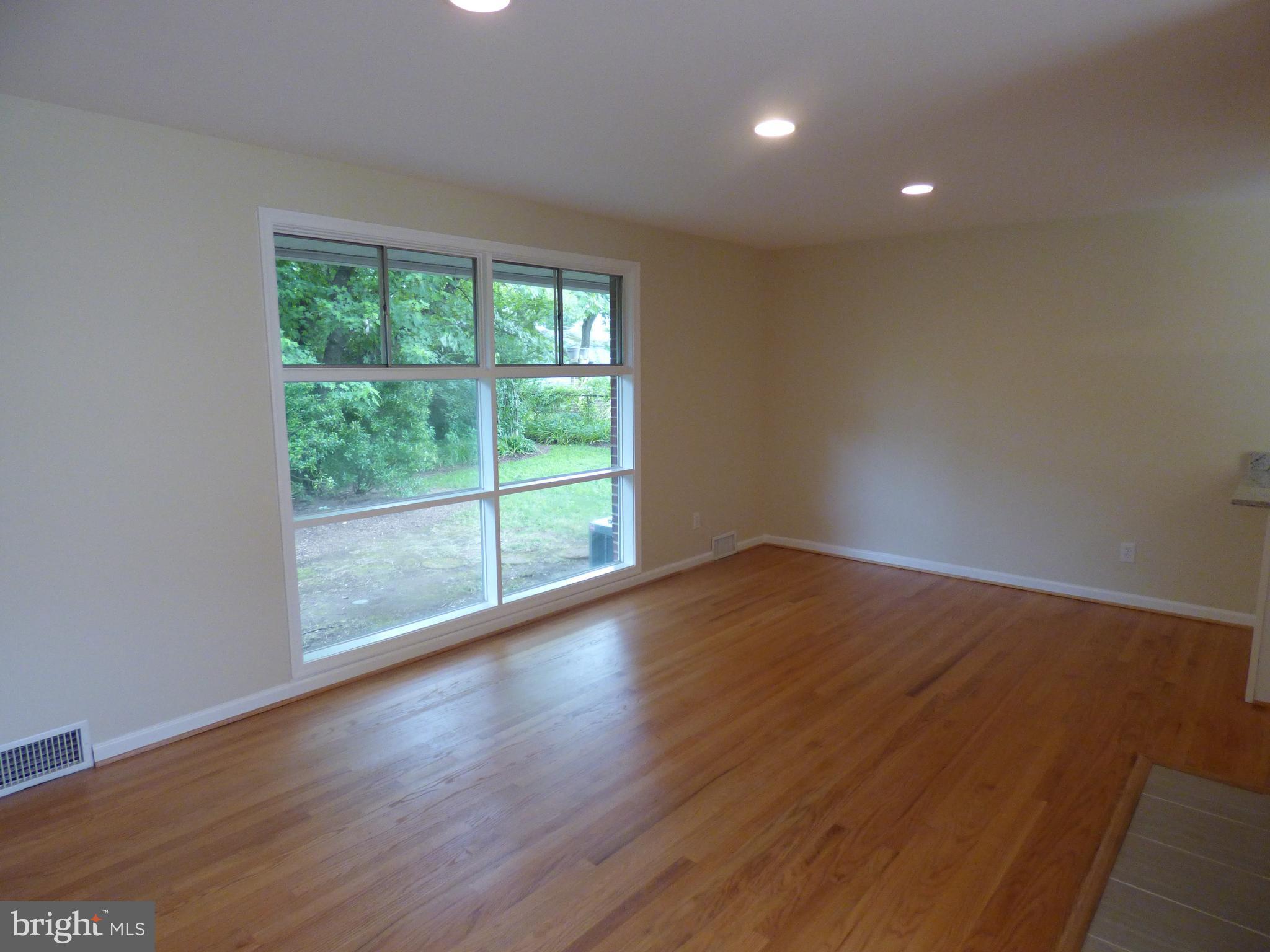 6603 Edsall Road Springfield, VA 22151 - Photo 9 of 30 a view of wooden floor and windows in a room
