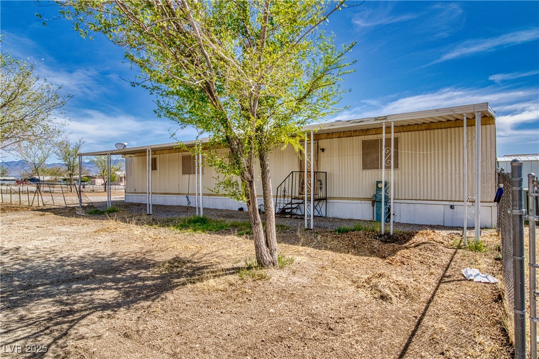 2631 Retread Road Pahrump, NV 89048 - Photo 6 of 18 View of front of house featuring fence