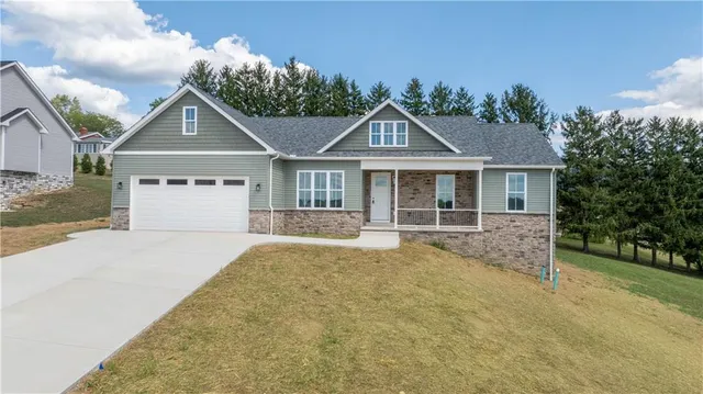front view of a house with a yard