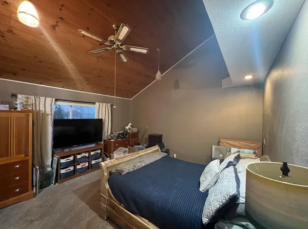 a room with furniture and flat screen tv