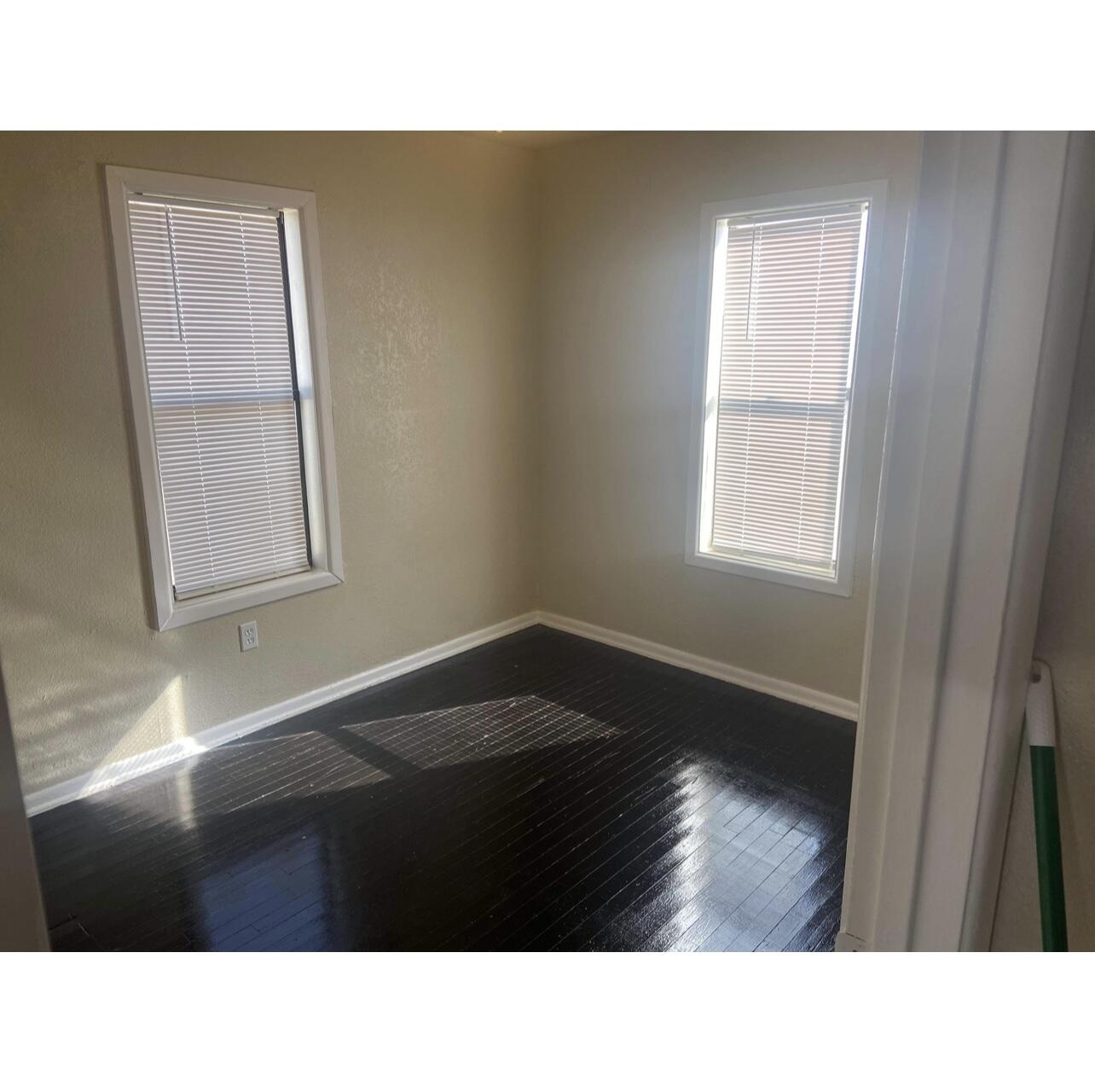 2411 Cedar Avenue Lubbock, TX 79404 - Photo 5 of 6 a black and white photo of a living room