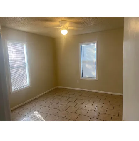 a black and white photo of a living room