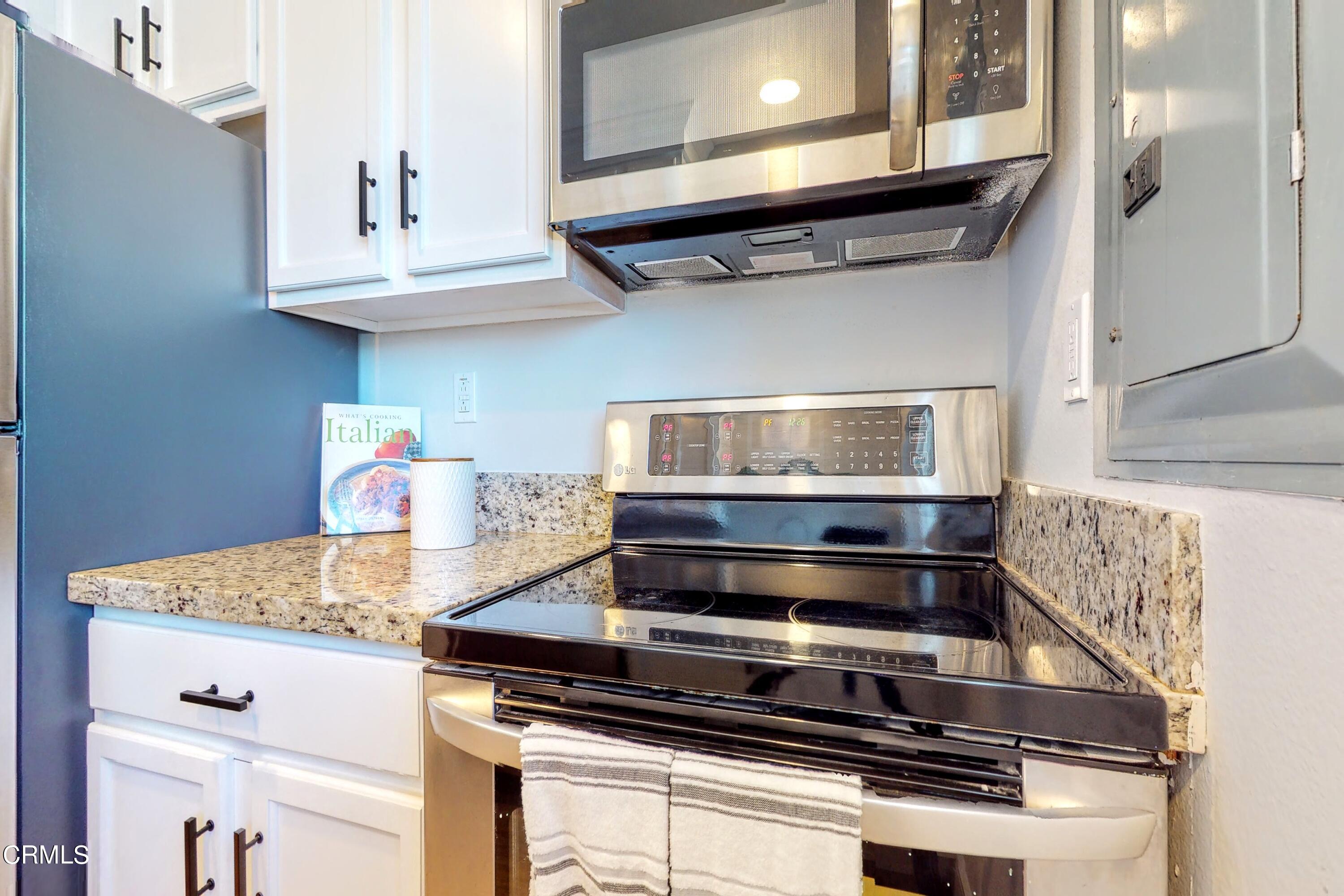 263 South Ventura Road, Unit 272 Port Hueneme, CA 93041 - Photo 13 of 40 a stove top oven sitting inside of a kitchen