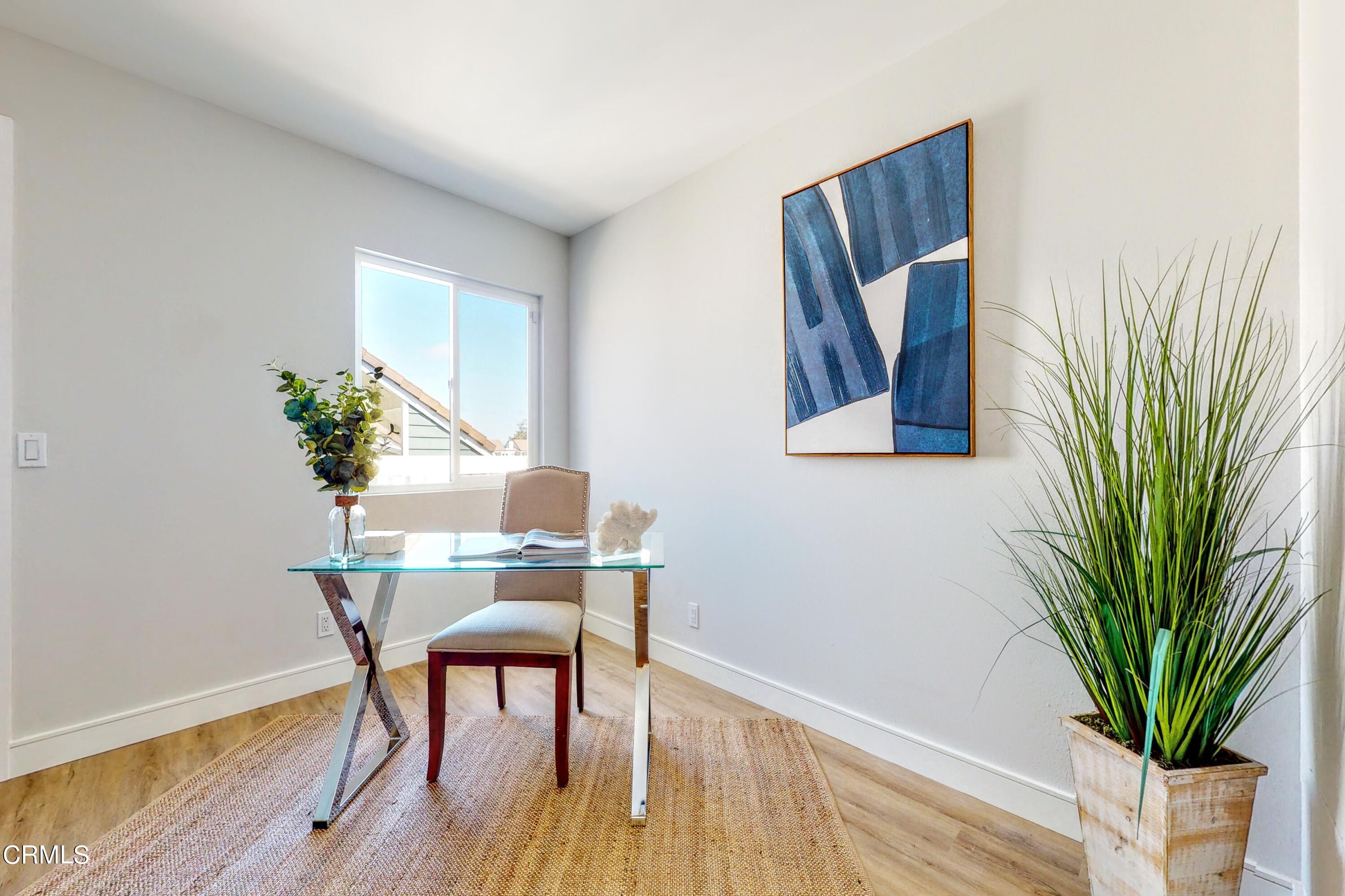 263 South Ventura Road, Unit 272 Port Hueneme, CA 93041 - Photo 26 of 40 a view of a workspace with furniture and a potted plant