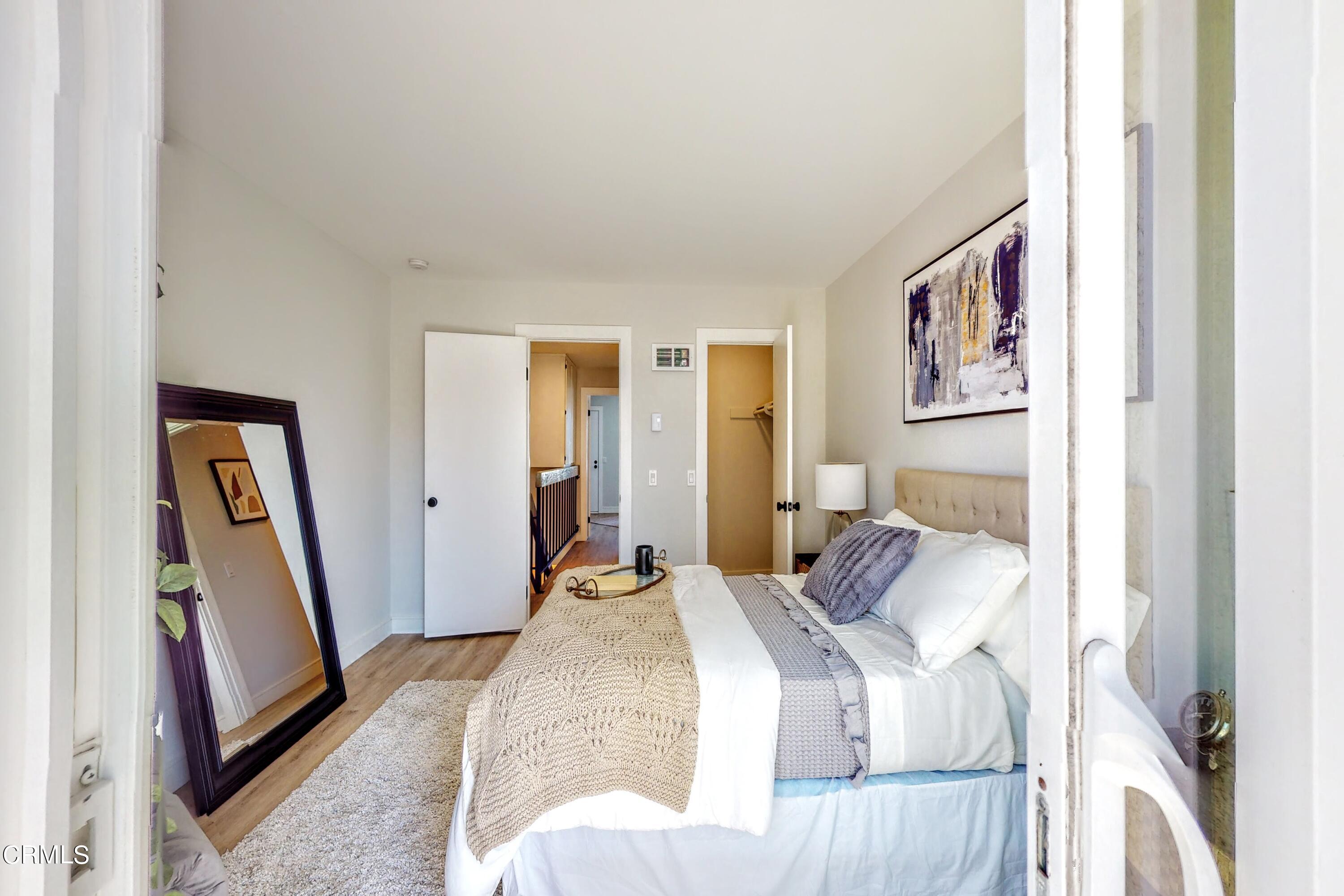 263 South Ventura Road, Unit 272 Port Hueneme, CA 93041 - Photo 31 of 40 a bedroom with a bed and a flat screen tv