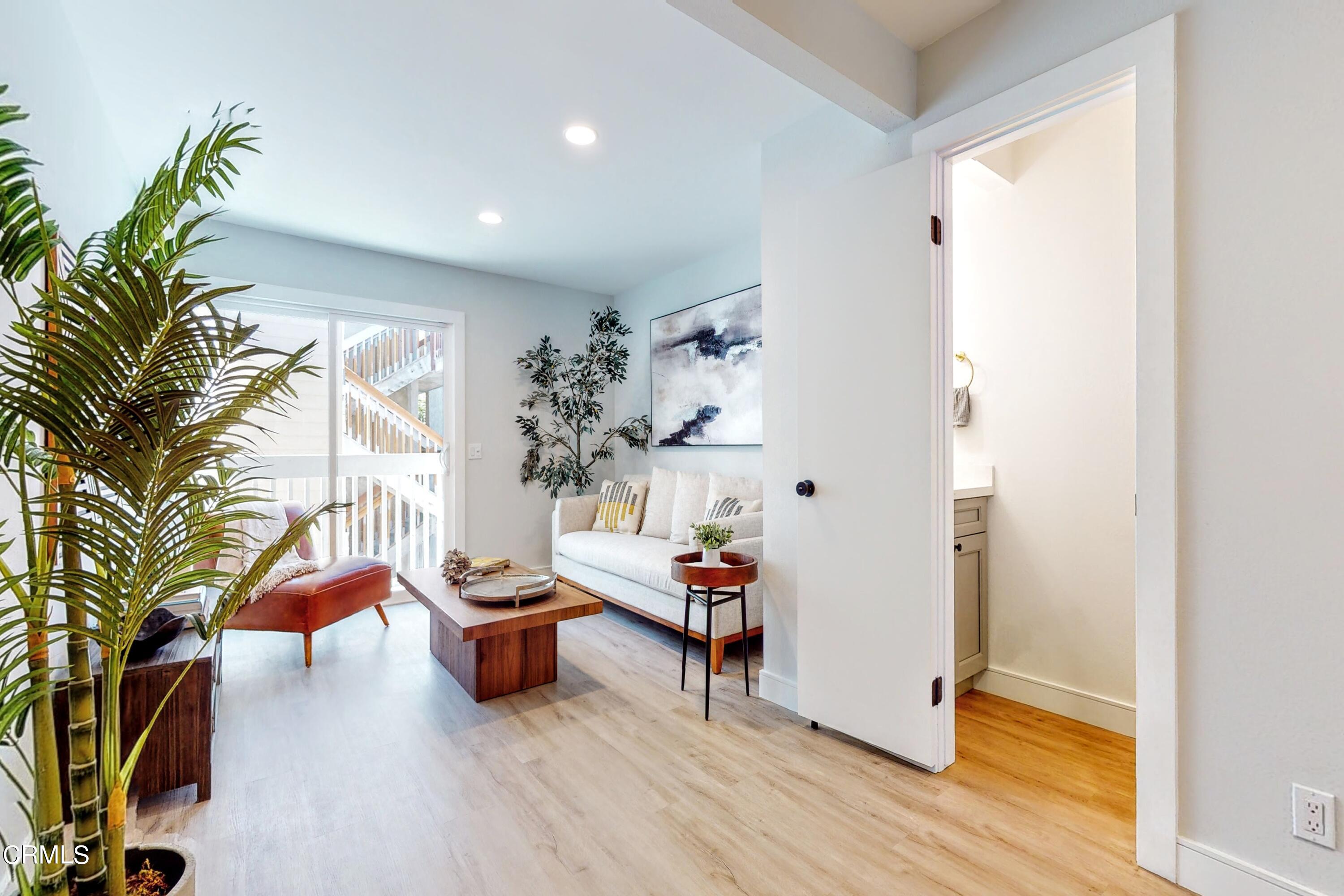 263 South Ventura Road, Unit 272 Port Hueneme, CA 93041 - Photo 4 of 40 a living room with furniture and a potted plant