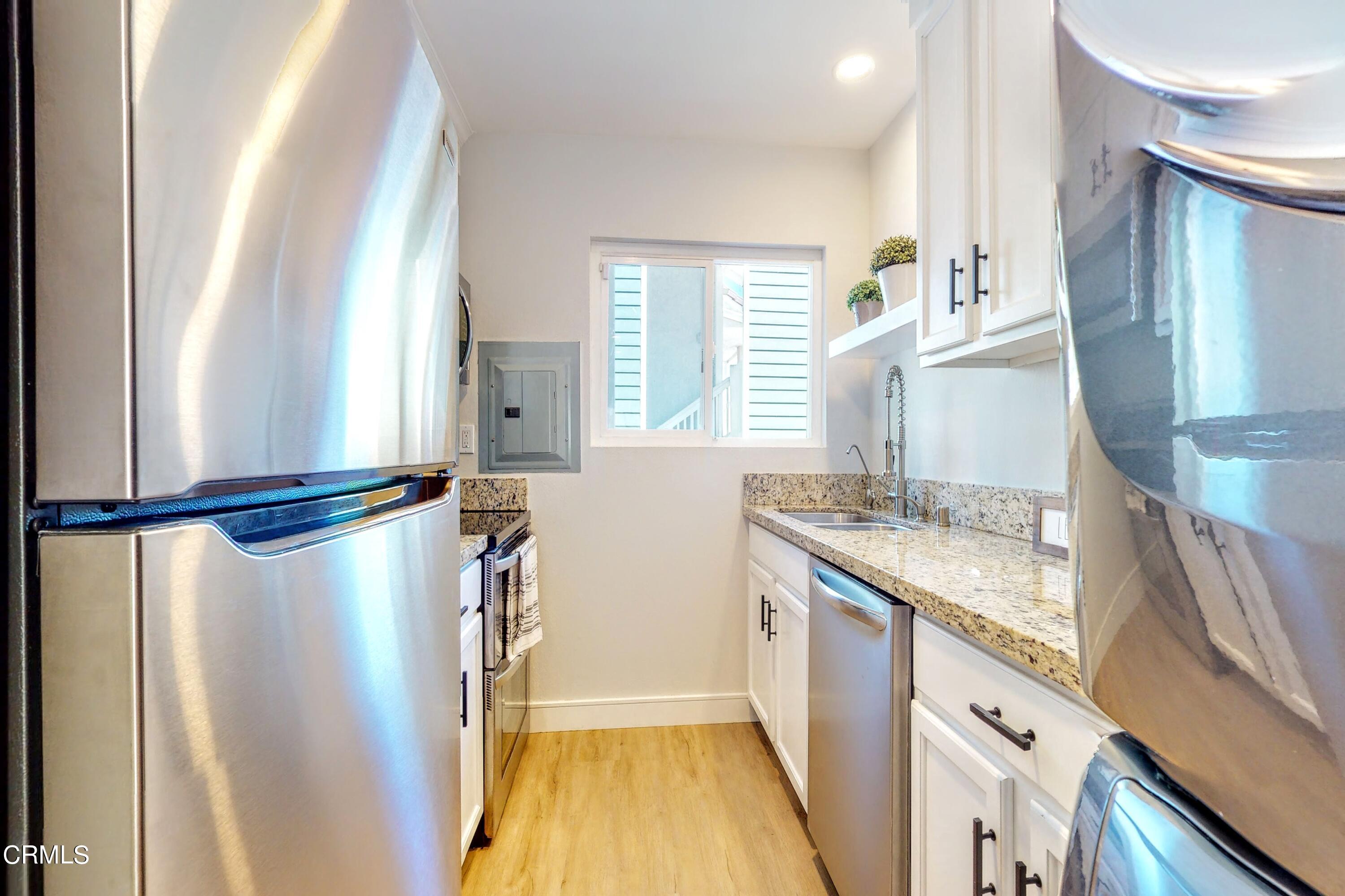 263 South Ventura Road, Unit 272 Port Hueneme, CA 93041 - Photo 10 of 40 a kitchen with a sink appliances and cabinets