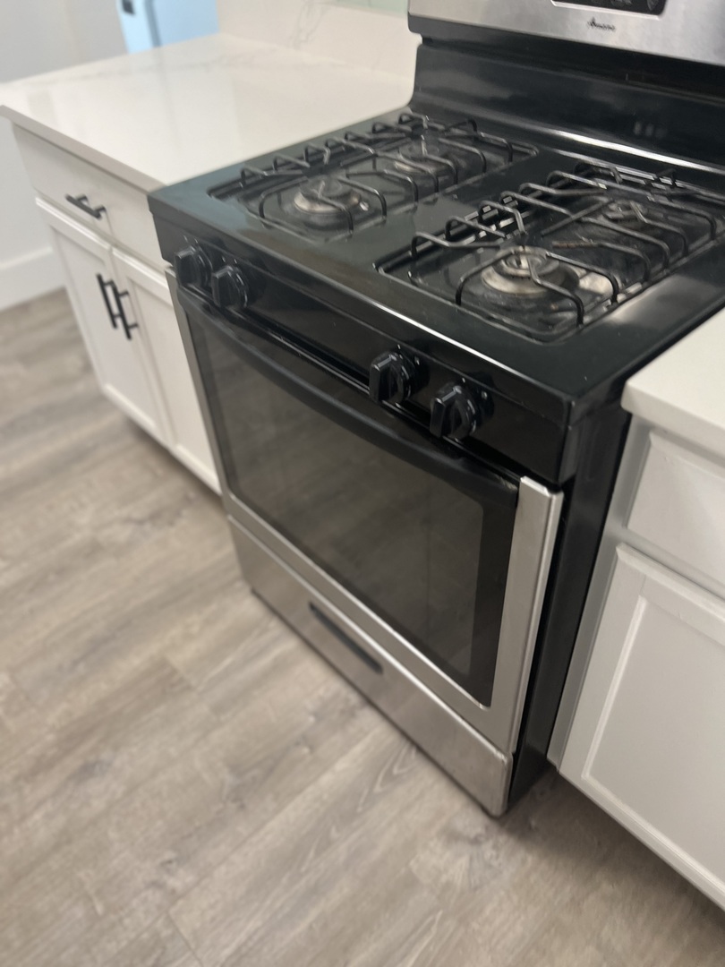 7446 64th Street, Unit 2F Summit, IL 60501 - Photo 11 of 14 a close up of a stove top oven sitting on a counter