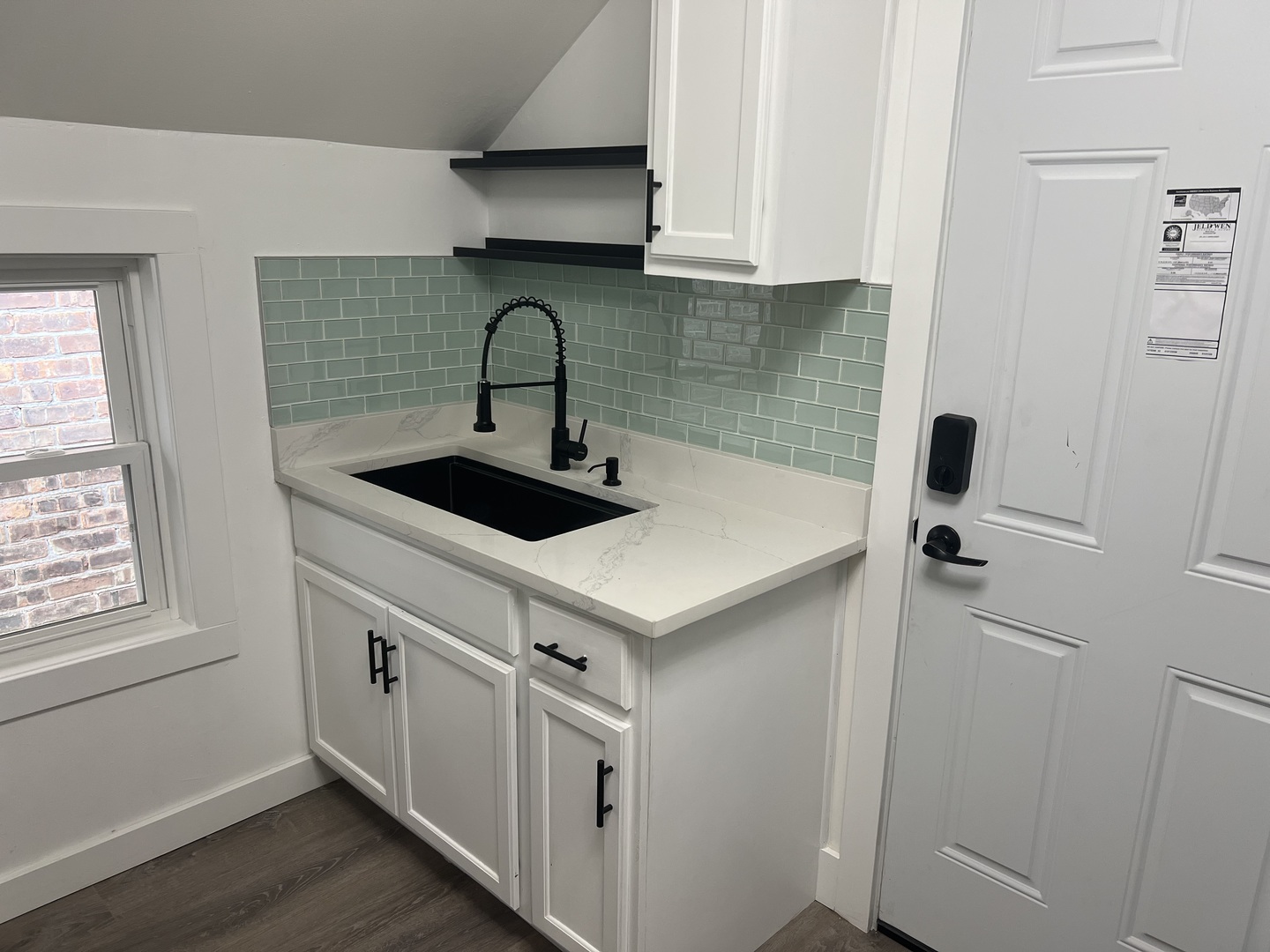 7446 64th Street, Unit 2F Summit, IL 60501 - Photo 13 of 14 a kitchen with stainless steel appliances granite countertop a sink and dishwasher a refrigerator with wooden cabinets