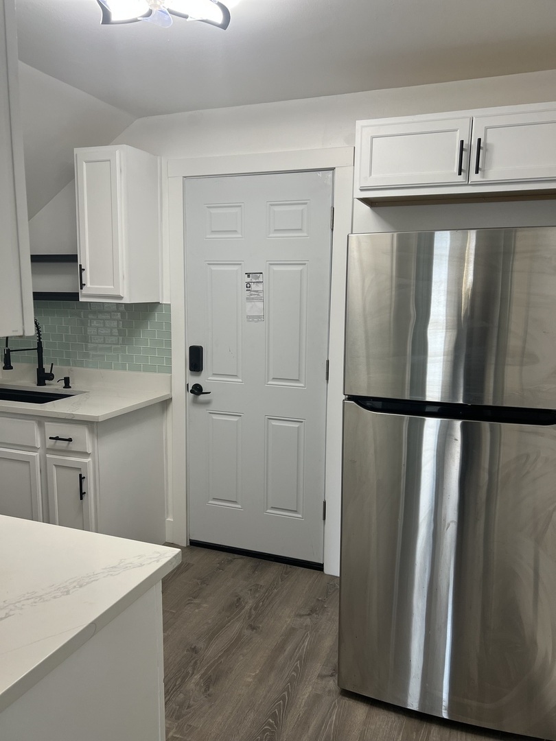 7446 64th Street, Unit 2F Summit, IL 60501 - Photo 14 of 14 a kitchen with a refrigerator sink and cabinets