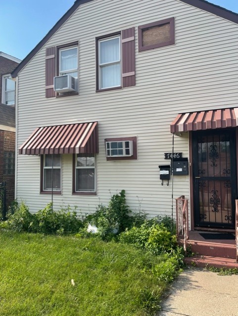 7446 64th Street, Unit 2F Summit, IL 60501 - Photo 2 of 14 a front view of a house with garden