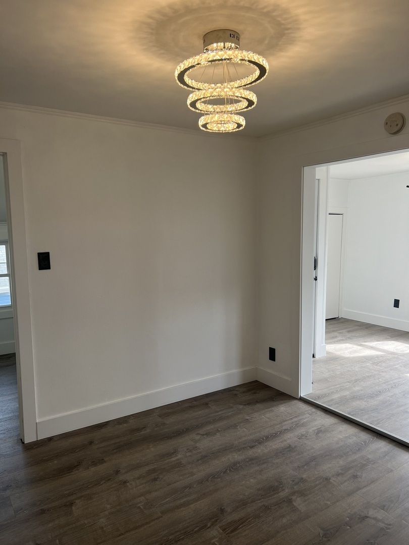 7446 64th Street, Unit 2F Summit, IL 60501 - Photo 3 of 14 a view of empty room with wooden floor