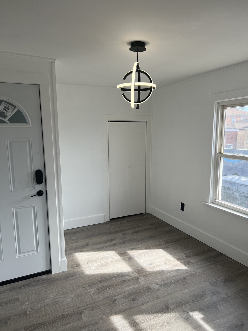 7446 64th Street, Unit 2F Summit, IL 60501 - Photo 9 of 14 a view of an empty room with a window