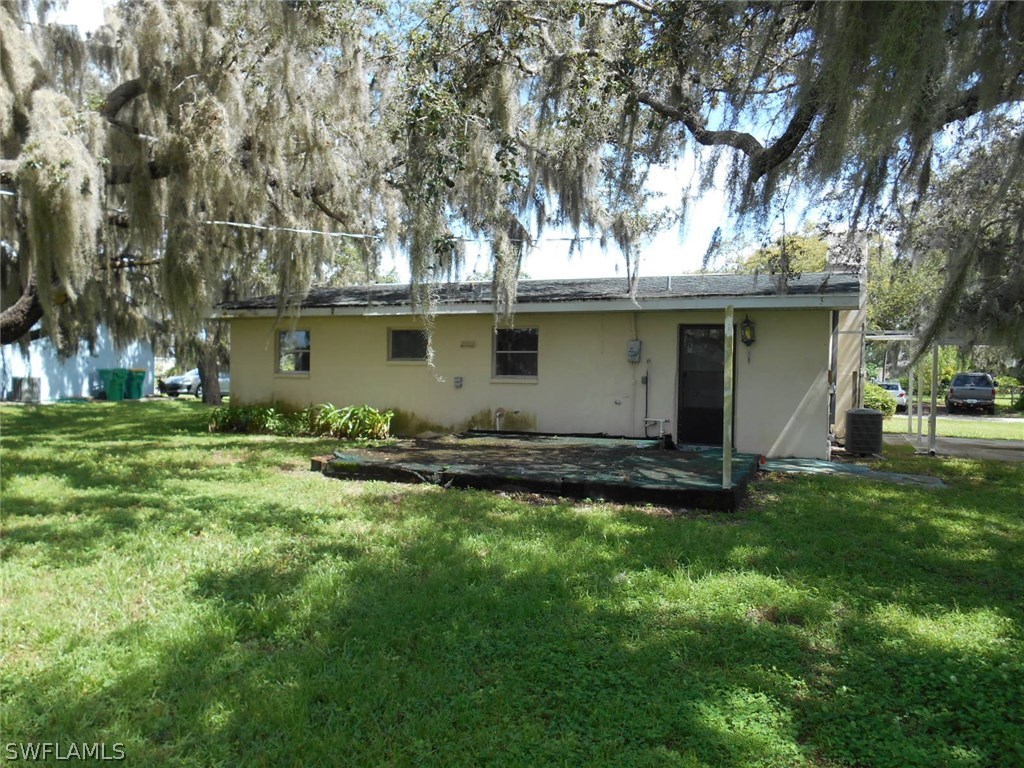30399 Holly Road Punta Gorda, FL 33982 - Photo 1 of 5 a view of a backyard with a garden