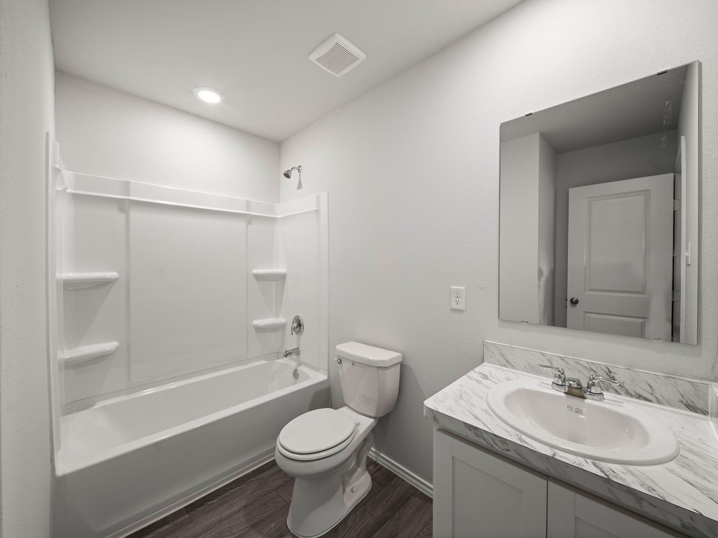 216 Stoney Ridge Lufkin, TX 75904 - Photo 16 of 21 a bathroom with a sink toilet vanity and shower
