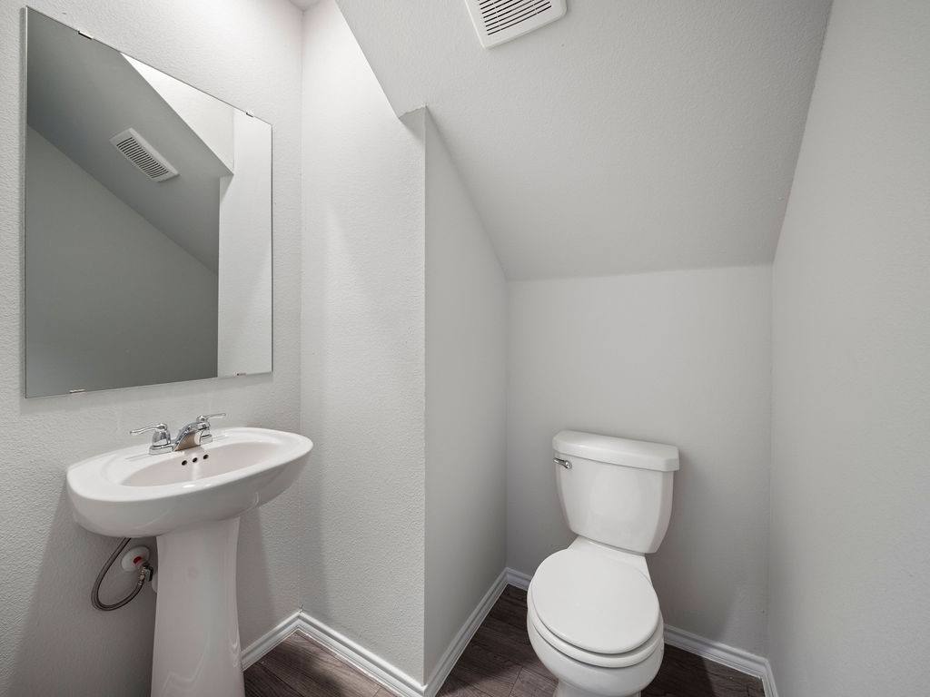 216 Stoney Ridge Lufkin, TX 75904 - Photo 7 of 21 a bathroom with a sink a toilet and mirror