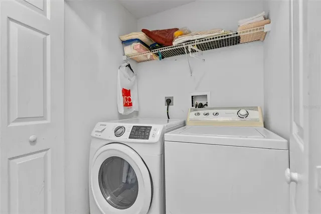 a utility room with dryer and washer