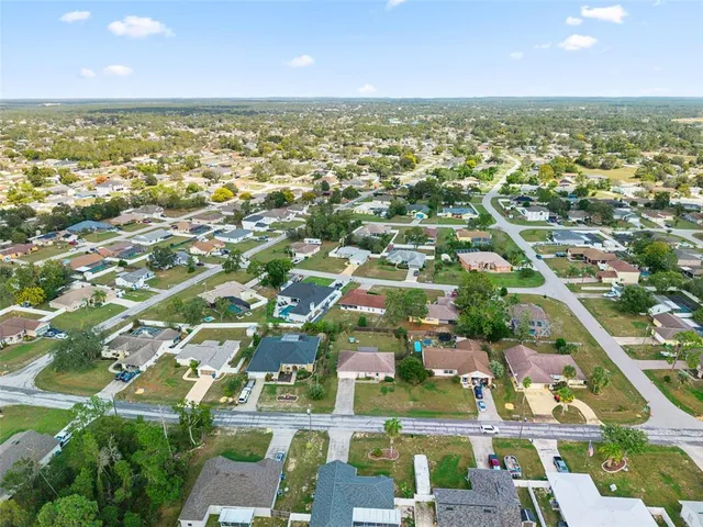 an aerial view of residential building with parking space