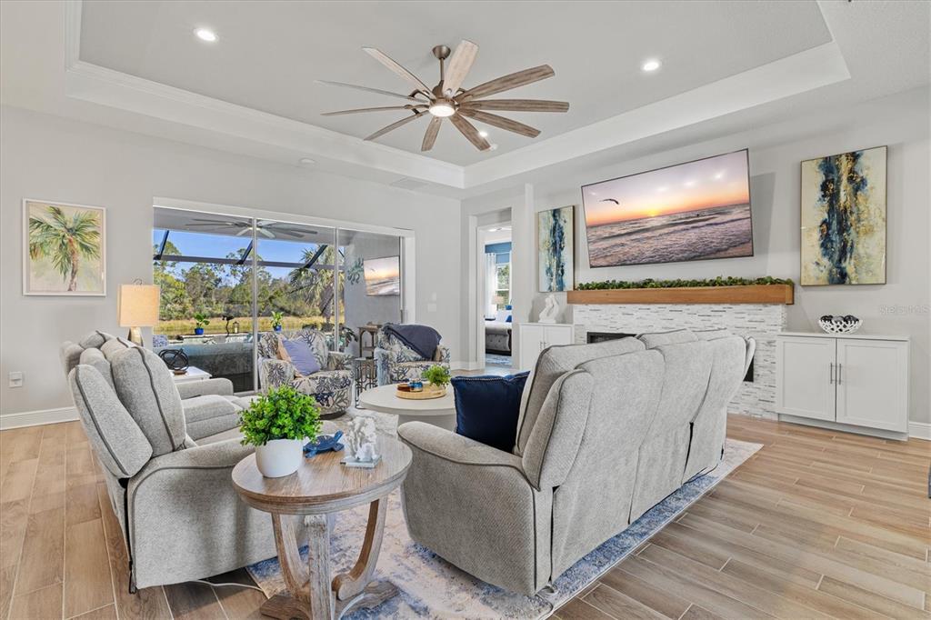 12436 Destin Loop Venice, FL 34293 - Photo 11 of 85 a living room with furniture and a flat screen tv