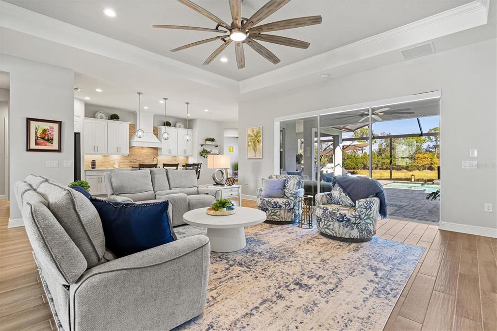 12436 Destin Loop Venice, FL 34293 - Photo 13 of 85 a living room with furniture and a wooden floor
