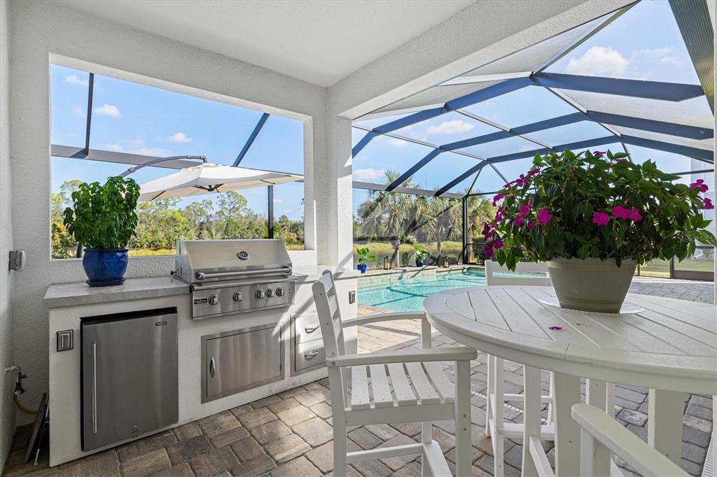 12436 Destin Loop Venice, FL 34293 - Photo 44 of 85 a kitchen with a stove a sink and cabinets