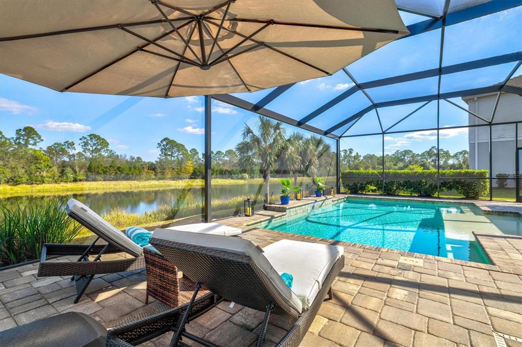 12436 Destin Loop Venice, FL 34293 - Photo 5 of 85 a view of a swimming pool with a patio