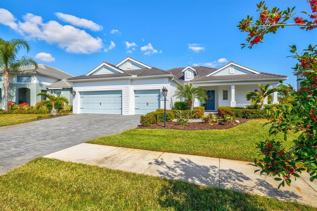 12436 Destin Loop Venice, FL 34293 - Photo 57 of 85 a front view of a house with a yard and a garage